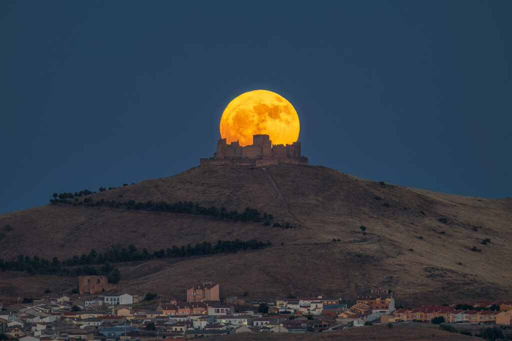 The moon emerging from the castle