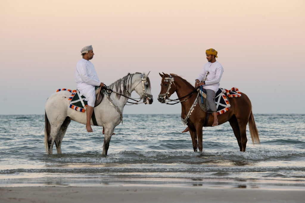 Sunset Riders by the Omani Shore