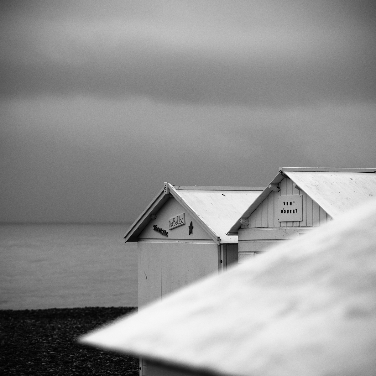 Beach Huts in Rain by Ralf Driere